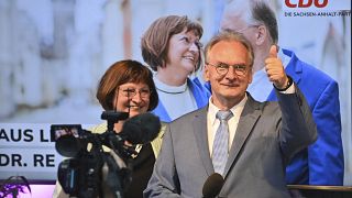 Saxony-Anhalt state governor Reiner Haseloff of Merkel's Christian Democratic Union party, CDU, and his wife Gabriele react, at the CDU election party.