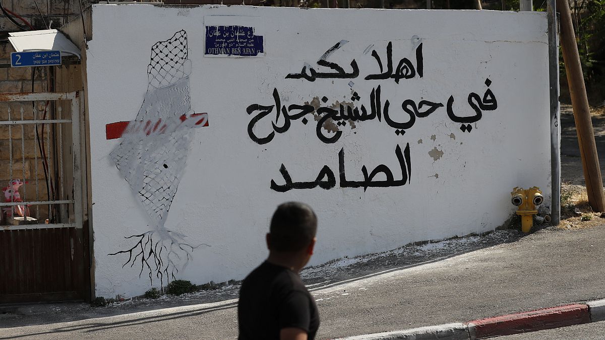 شعار بالعربية "أهلا بكم في حي الشيخ جراح المتعنت" في 25 مايو- أيار 2021، في حي الشيخ جراح بالقدس الشرقية المحتلة الذي ضمته إسرائيل.