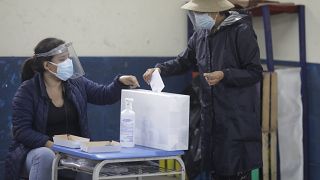 A voter casts her ballot during a run-off presidential election in Lima, Peru, Sunday, June 6, 2021.