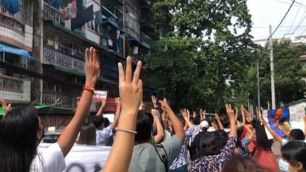 Dozens march briskly through Yangon in flash Myanmar protest