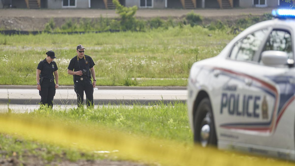 London Police investigate the scene of the attack in Ontario on Monday.