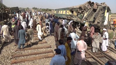 People working on the tracks after deadly train crash