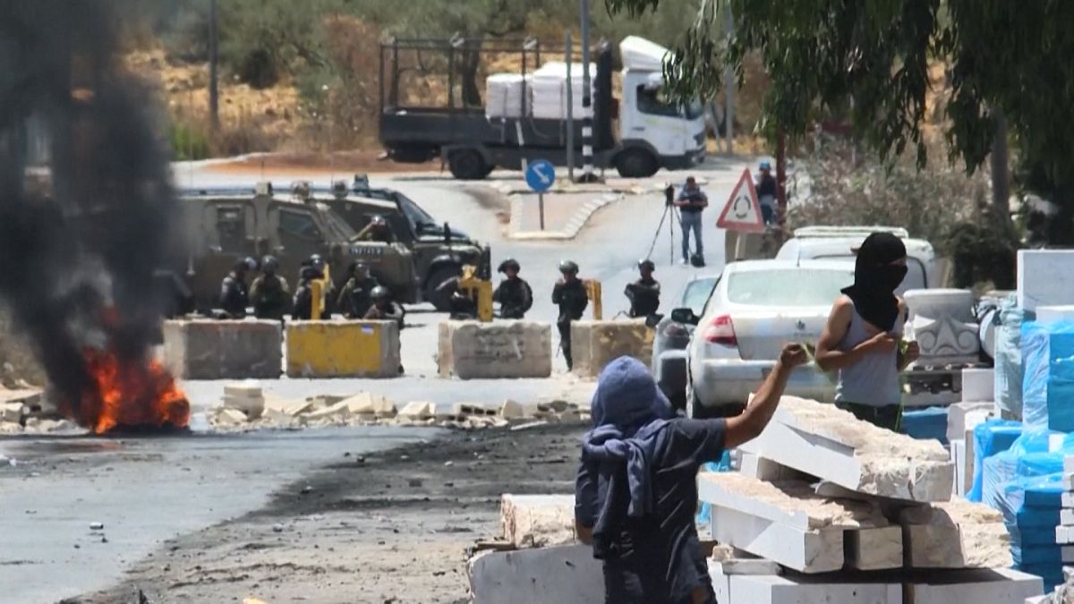 Palestinian protesters clash with Israeli security forces in the village of Beita, south of Nablus, in the occupied West Bank
