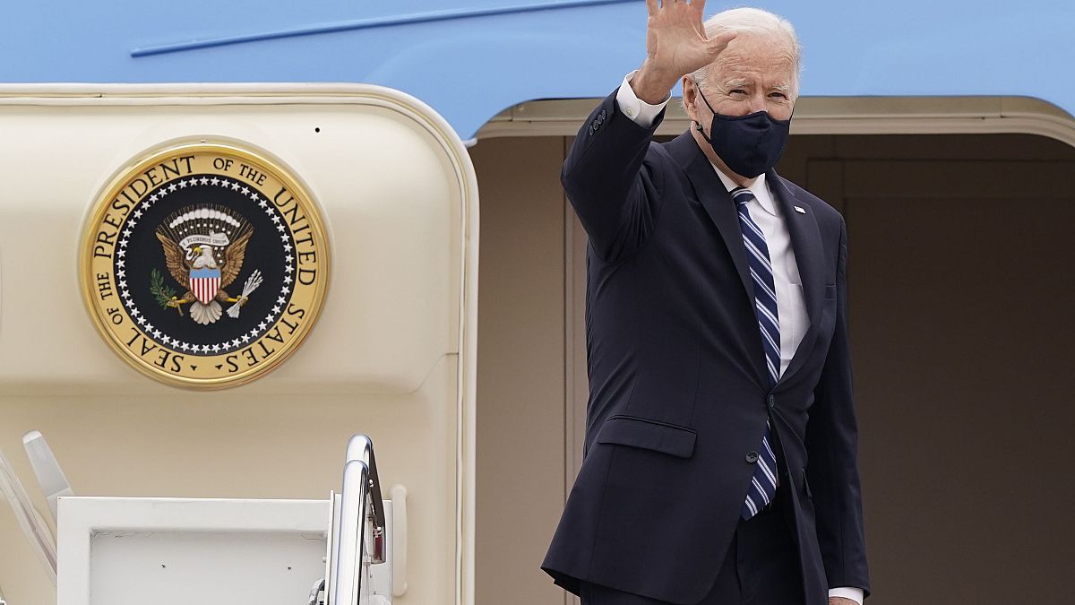 US President Joe Biden waves from the top of the steps of Air Force One at Andrews Air Force Base, on March 16, 2021. 