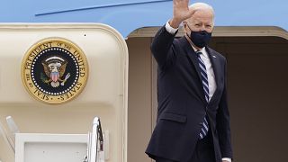 US President Joe Biden waves from the top of the steps of Air Force One at Andrews Air Force Base, on March 16, 2021. 