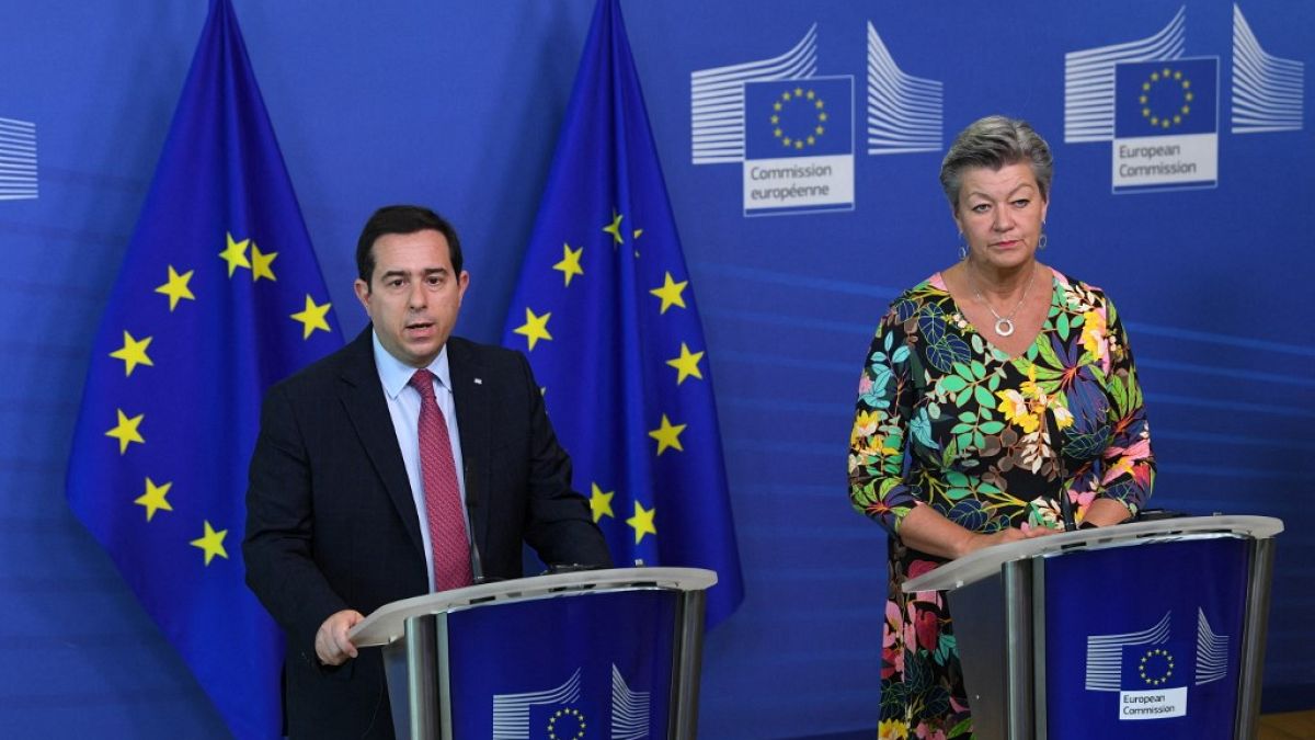 Greek Minister of Migration and Asylum Notis Mitarachi (L) and EU commissioner for Home Affairs Sweden's Ylva Johansson