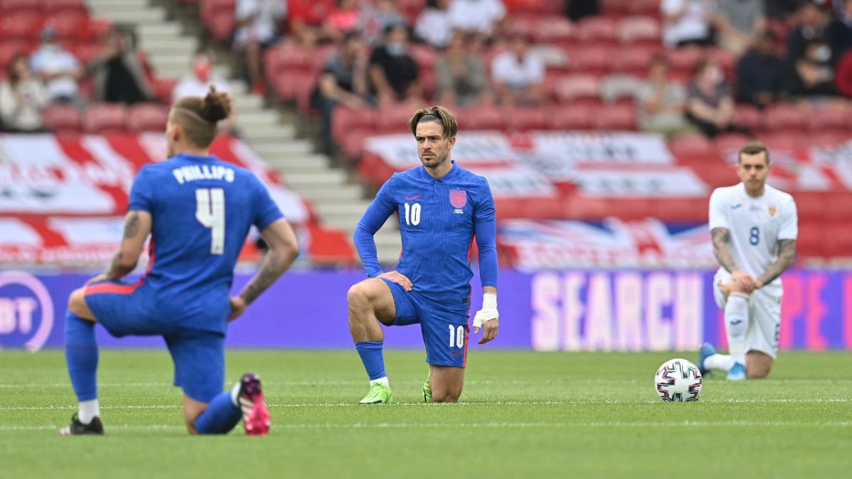 England's Jack Grealish takes a knee before the international friendly soccer match between England and Romania in Middlesbrough, England, Sunday, June 6, 2021. 