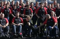 FILE - Britain's Prince Harry poses with the team during the announcement of the British Armed Forces team for the Invictus Games in London, Wednesday, Aug. 13, 2014