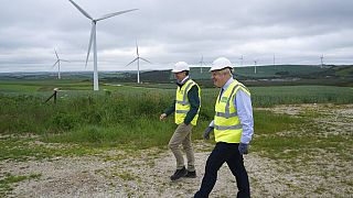 Boris Johnson visits Scottish Power Carland Cross Windfarm to view new construction on a solar farm in Newquay, Cornwall, England