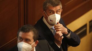 Czech Republic's Prime Minister Andrej Babis adjusts his face mask during a parliament session in Prague, Czech Republic, Thursday, June 3, 2021. 