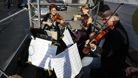 Budapest orchestra performs live concert from moving truck