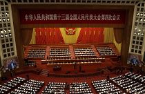 Delegates attend the opening session of China's National People's Congress (NPC) at the Great Hall of the People in Beijing on March 5, 2021.