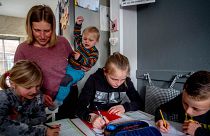 A mother homeschools her children amid a spike in parents opting to home-educate in the UK