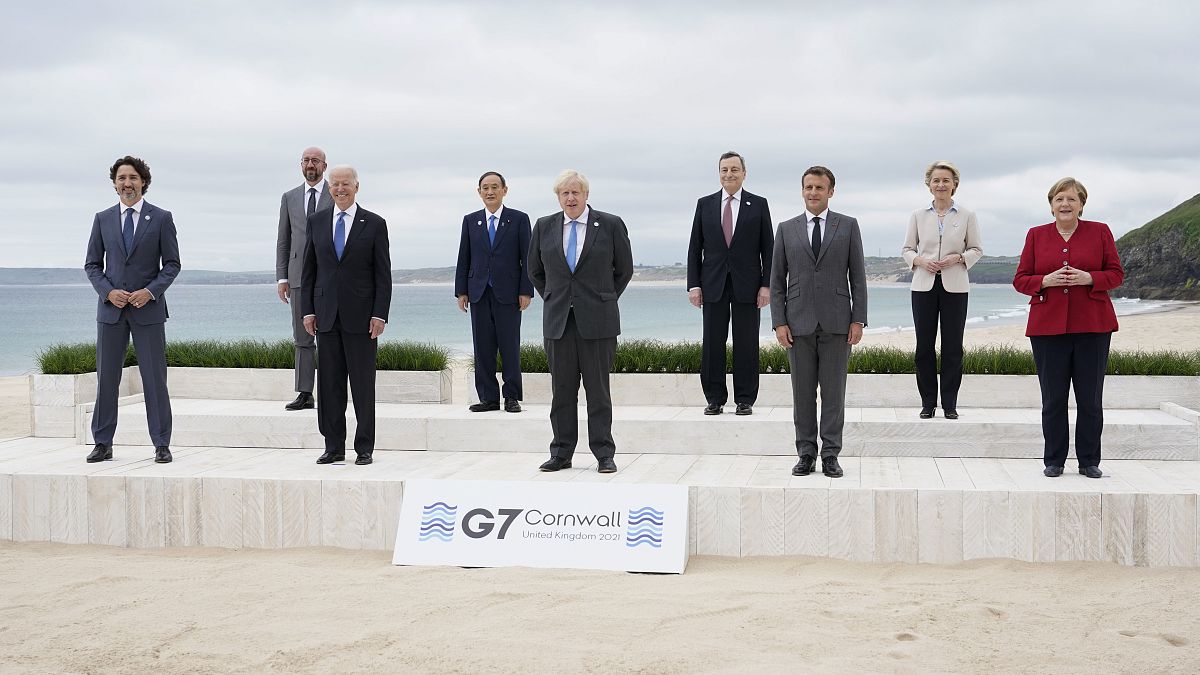 Leaders of the G7 pose for a group photo on overlooking the beach at the Carbis Bay Hotel in Carbis Bay, St. Ives, Cornwall, England, Friday, June 11, 2021.