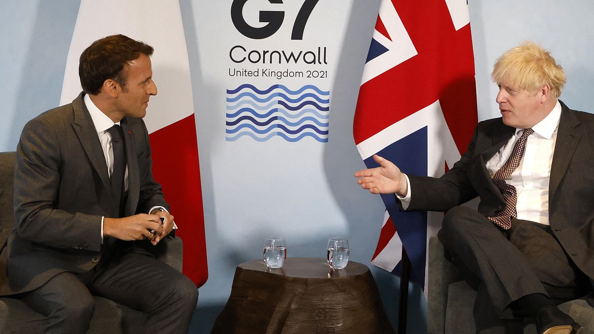 Britain's Prime Minister Boris Johnson and France's President Emmanuel Macron take part in a bilateral meeting during the G7 summit in Carbis bay, Cornwall on June 12, 2021.