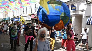 Environmental groups stage theatrical protests near to G7 leaders venue