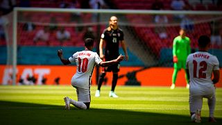 European football split over the act of kneeling