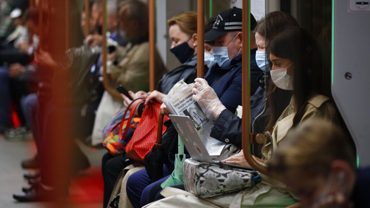 People wearing face mask to help curb the spread of the coronavirus ride a subway car in Moscow, Russia, Thursday, June 10, 2021.