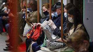 People wearing face mask to help curb the spread of the coronavirus ride a subway car in Moscow, Russia, Thursday, June 10, 2021.