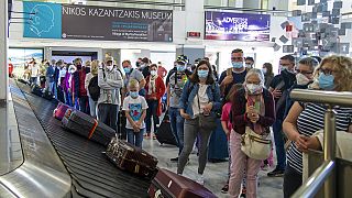  passengers from Hanover wait to pick their luggage at Nikos Kazantzakis International Airport in Heraklion