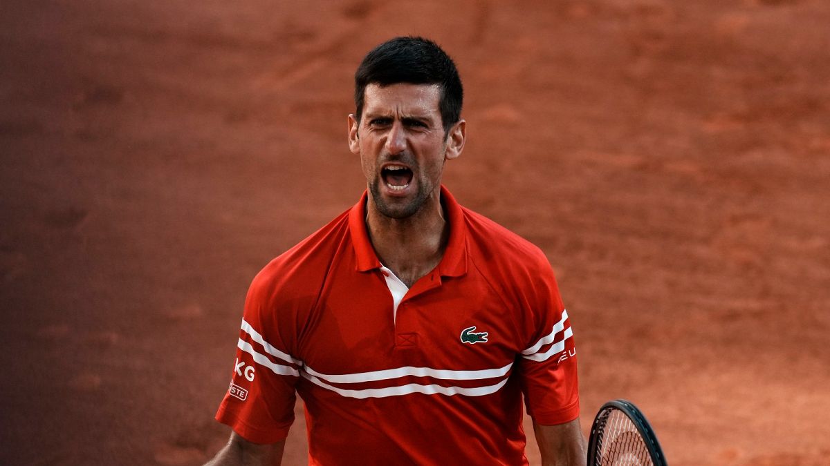 Serbia's Novak Djokovic defeats Stefanos Tsitsipas of Greece 6-7, 2-6, 6-3, 6-2, 6-4 to win the French Open Sunday, June 13, 2021