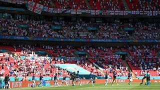 Players enter the pitch to play the Euro 2020 soccer championship group D match between England and Croatia, at Wembley stadium, London, Sunday, June 13, 2021
