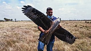 One of the Alasoluciones team holding their hawk drone.