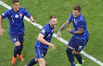 Slovakia's Milan Skriniar, centre, celebrates after scoring his side's second goal during the Euro 2020 soccer championship group E match between Poland and Slovakia