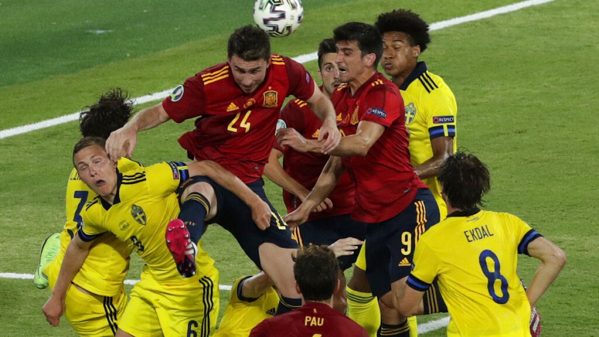 Spain's Aymeric Laporte goes for a header during the Euro 2020 soccer championship group E soccer match between Spain and Sweden