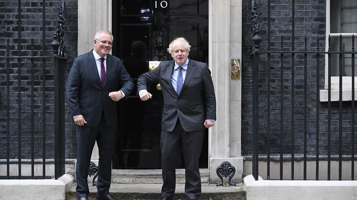 Britain's Prime Minister Boris Johnson, left, greets Australia's Prime Minister Scott Morrison at 10 Downing Street, in London, June 14, 2021. 