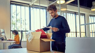 Man unpacking delivery package 