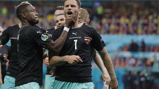 Marko Arnautovic (right) celebrates with his Austrian teammates after scoring during Sunday's UEFA Euro 2020 group match against North Macedonia.