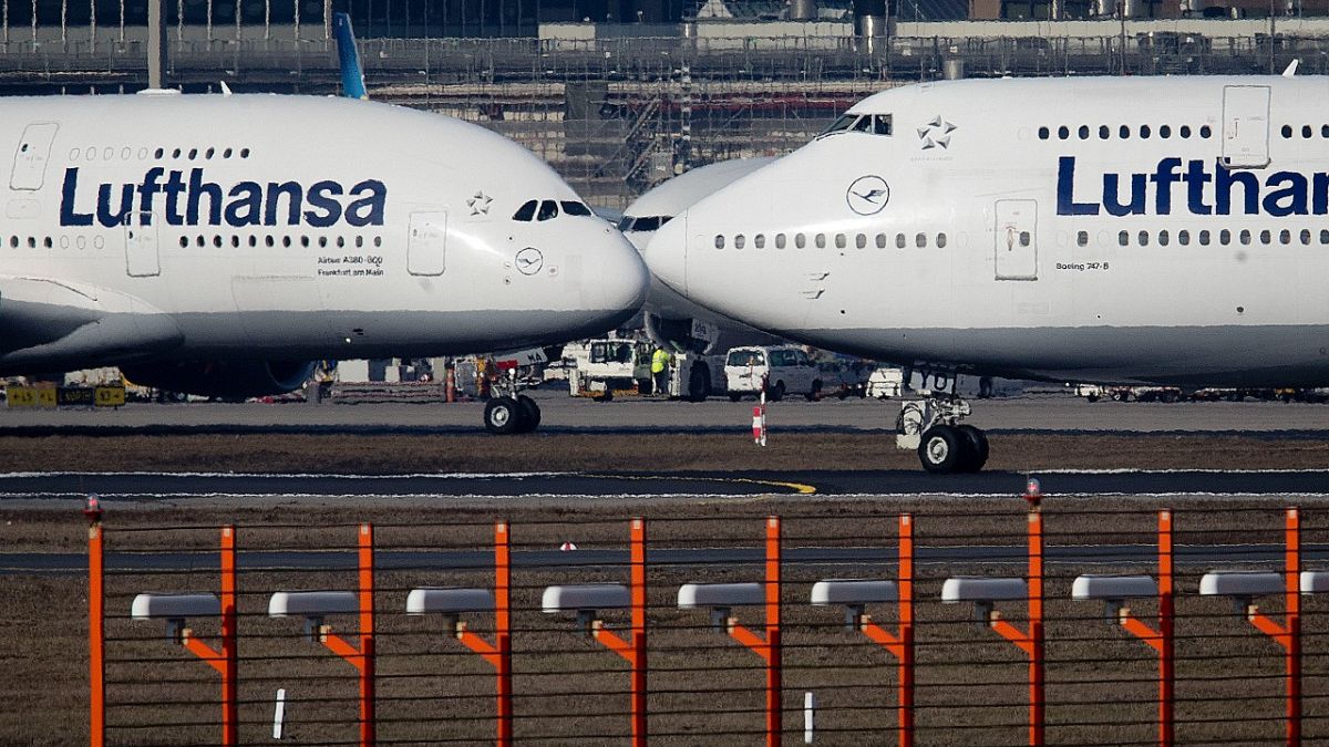Airbus A380, left, and a Boeing 747, both from Lufthansa airline pass each other at the airport in Frankfurt, Germany on Feb.14, 2019