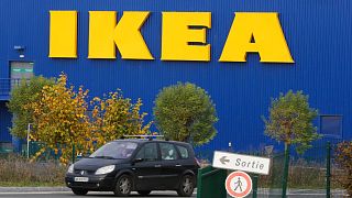 A car drives past the IKEA store in Plaisir, west of Paris, Nov. 20, 2013. 