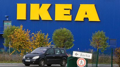 A car drives past the IKEA store in Plaisir, west of Paris, Nov. 20, 2013.