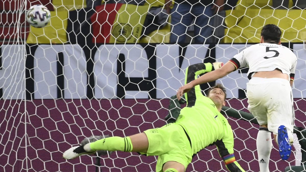 Germany's Mats Hummels, right, scores an own goal past Germany's goalkeeper Manuel Neuer during the Euro 2020.