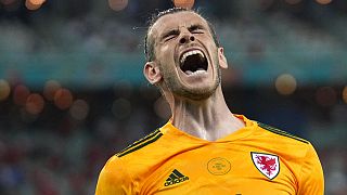 Wales' Gareth Bale celebrates after his teammate Wales' Connor Roberts scored his sides second goal