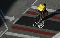 A delivery worker rides in Barcelona