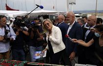 Far-right leader Marine Le Pen gestures as she campaigns at an open air market of Six-Fours-les-Plages, southern France, Thursday, June 17, 2021