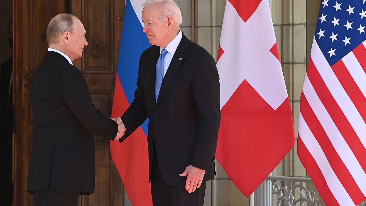 Russian President Vladimir Putin (L) shakes hands with US President Joe Biden prior to the US-Russia summit at the Villa La Grange, in Geneva on June 16, 2021. 