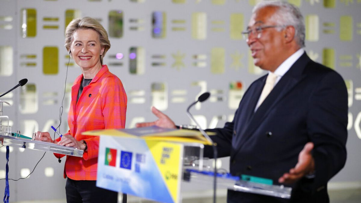 European Commission President Ursula von der Leyen smiles during a joint news conference with Portuguese Prime Minister Antonio Costa, right, at the Center for Living Science 