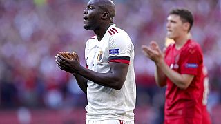 Belgium's Romelu Lukaku applauds during the break at the tenth minute to honour Denmark's Christian Eriksen during the Euro 2020 group B match between Denm