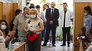 Incumbent prime minister Nikol Pashinyan waits in line to cast his vote in Yerevan on Sunday