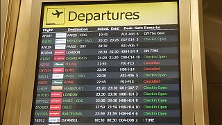 A departures board at JFK airport's Terminal 1, Friday, March 13, 2020, in New York. The EU is now recommending restrictions be lifted on US visitors.