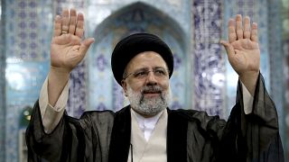 Ebrahim Raisi, a candidate in Iran's presidential elections waves to the media after casting his vote at a polling station in Tehran, Iran Friday, June 18, 2021