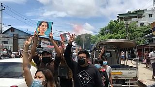 Protesters carried photos of ousted leader Suu Kyi