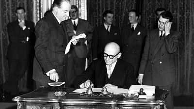 FILE - In this April 18, 1950 file photo, French Foreign Minister Robert Schuman signs a treaty.