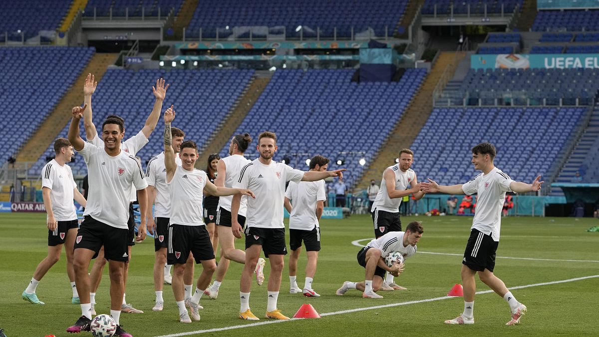 Players of Wales cheer during a team training session at Olympic stadium in Rome, Saturday, June 19, 2021 