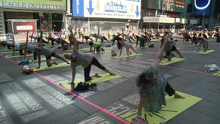 Times Square welcomes yogis back to celebrate the summer solstice