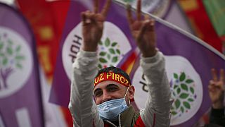 A member of the People's Democratic Party, or HDP, attends the start of Nowruz - or New Year - celebrations in Istanbul, Turkey in March